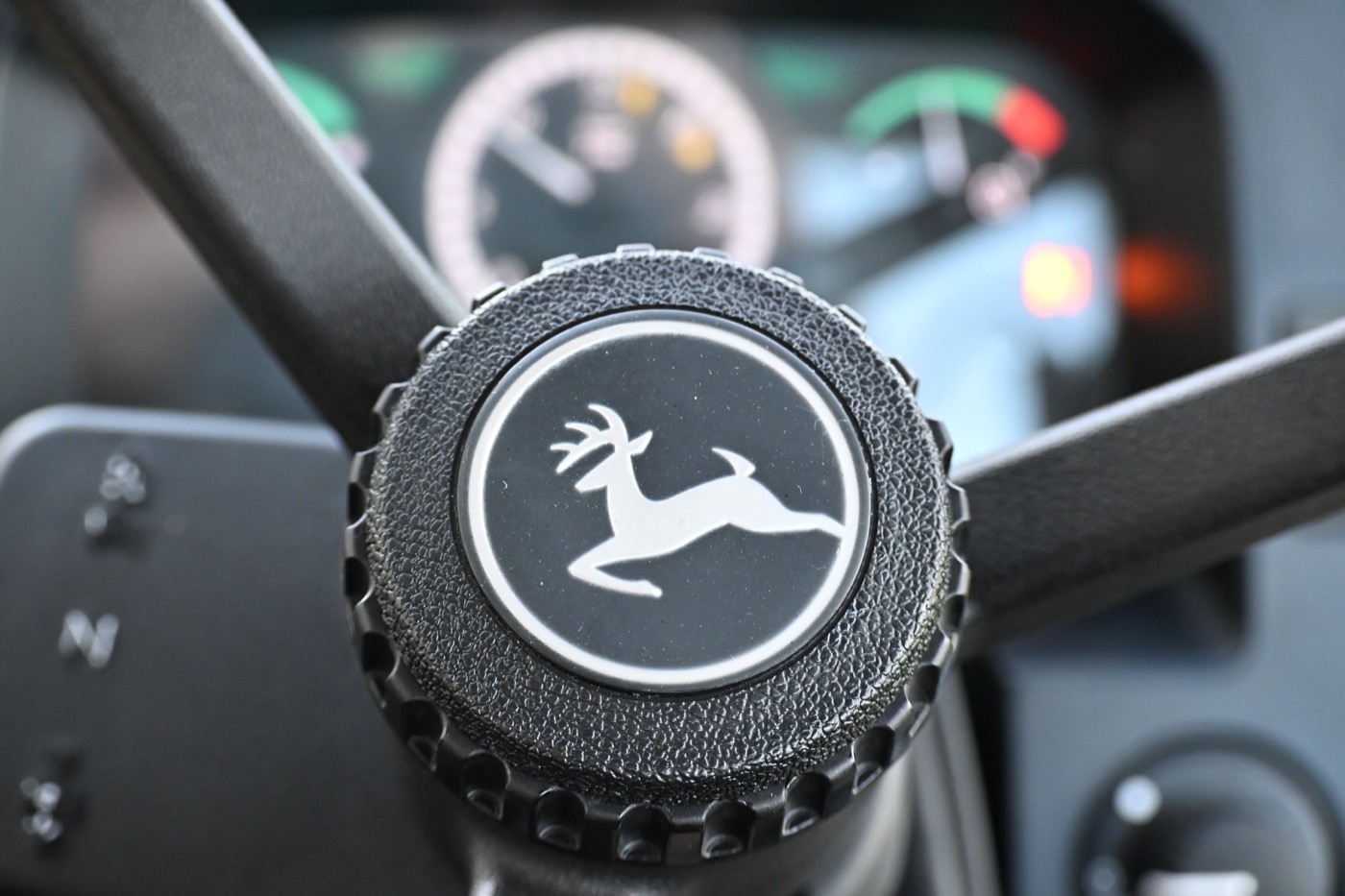 John Deere steering wheel with the instrument panel behind it